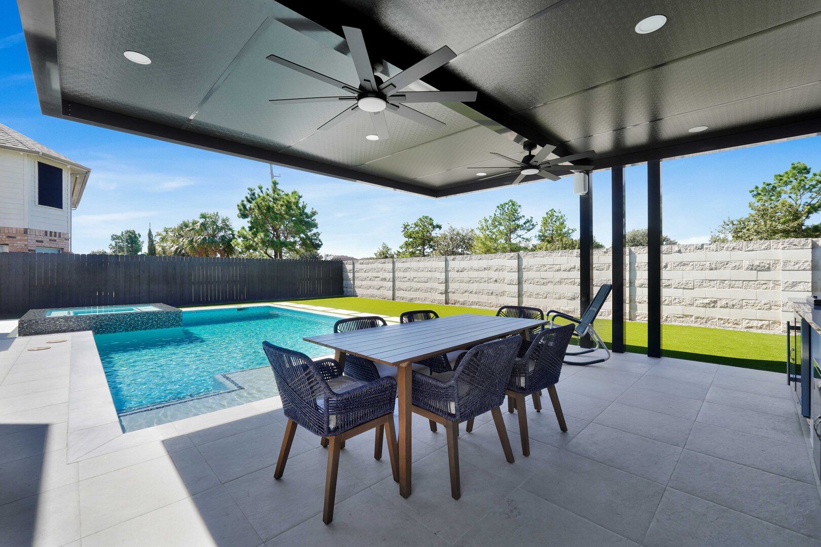 Patio near outdoor swimming pool - Orion Turf and Landscape
